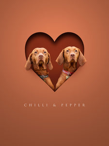 Unusual dog portrait of two vizslas appearing to sit inside a paper cutout heart shape giving a modern 3d effect