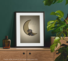 Load image into Gallery viewer, stylish, modern 3D-effect pet picture of a dachshund posed inside a crescent moon shape with a paper cutout look giving an unusual 3d effect. Framed in a black picture frame and propped on a sideboard