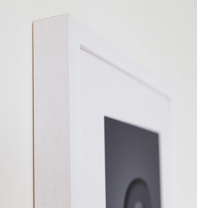 detail of white wooden picture frame