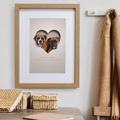 boxer dogs inside a cutout heart design with memorial words underneath and framed on wall in hall