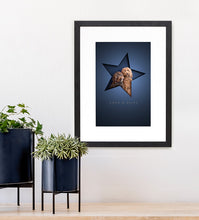 Load image into Gallery viewer, modern dog picture with 2 fluffy cockapoos sitting inside a star shape paper cutout that creates a very realistic 3d effect. Dark blue background and simple black wood frame. 