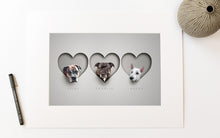 Load image into Gallery viewer, Modern dog picture in 16x12&quot; off-white mount. 3 dogs in 3 hearts in a realistic paper cut out style making it look 3d
