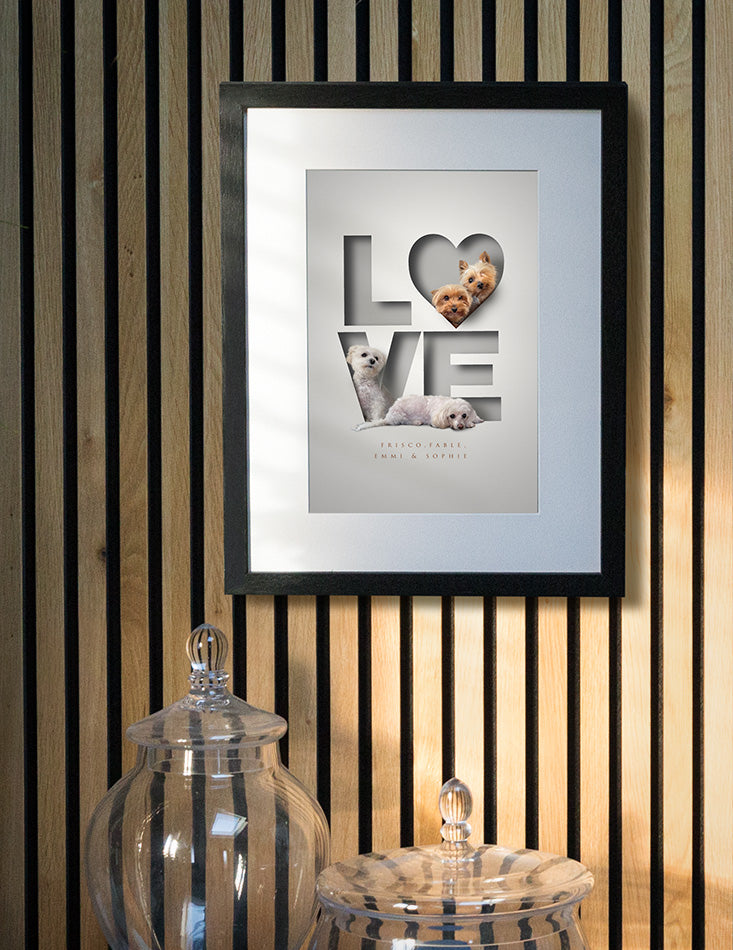 cute dog picture hanging on a trendy wall with 4 rescue dogs sitting inside a 3D-effect paper cutout of the word LOVE