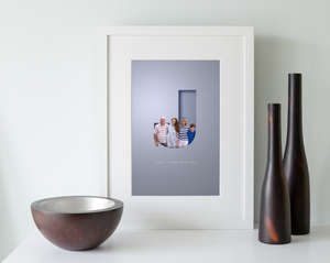 Modern family portrait in a 3D cut out effect letter J and their surname displayed in an elegant typeface underneath. Beautifully framed in a white wood picture frame