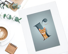 Load image into Gallery viewer, Stylish pet cat picture of a cute kitten that appears to be sitting inside a letter r that has been cut out of paper and gives a realistic 3d effect. The picture is in an off-white textured mount.