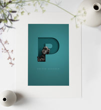 Load image into Gallery viewer, Aqua blue green personalised picture with cute black spaniel dog looking out of a 3D cutout effect letter P. Neat lettering of the dogs full name is written underneath the P. picture is in an off-white photo mount ready to go in a frame