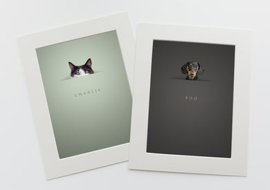Unique cat and dog portraits 2 pictures in white photo mounts of pets peeking above a horizon line and their names are written below in a serif font